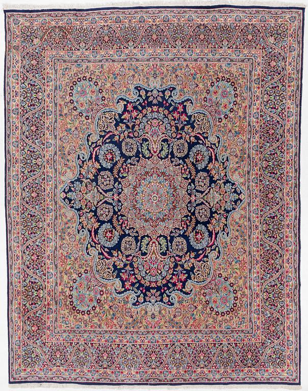 An oriental carpet, c. 385 x 300 cm.