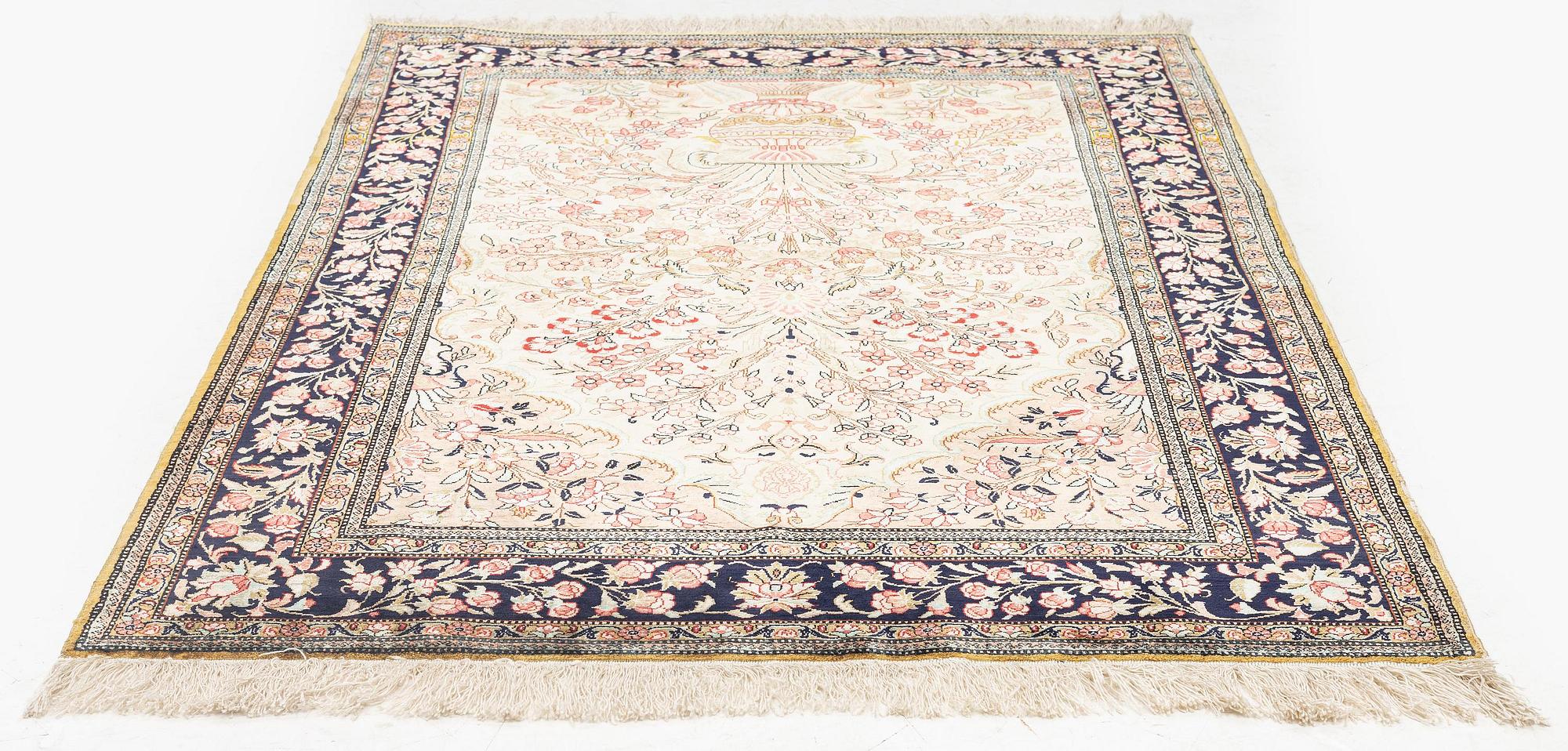 A silk Qum rug, c. 156 x 101 cm.