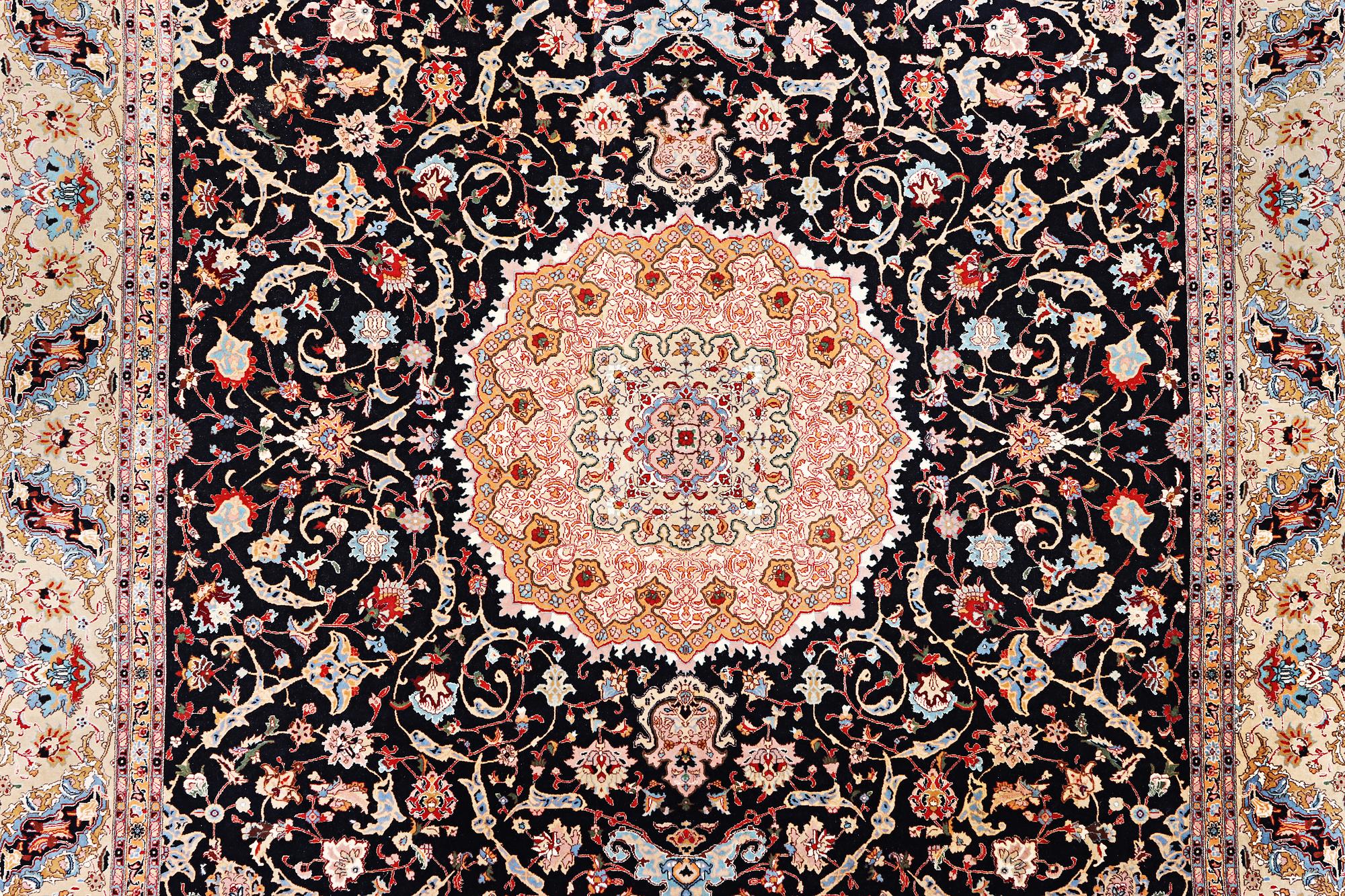 A semi.antique Tabriz carpet, 50 raj, c. 390 x 290 cm.
