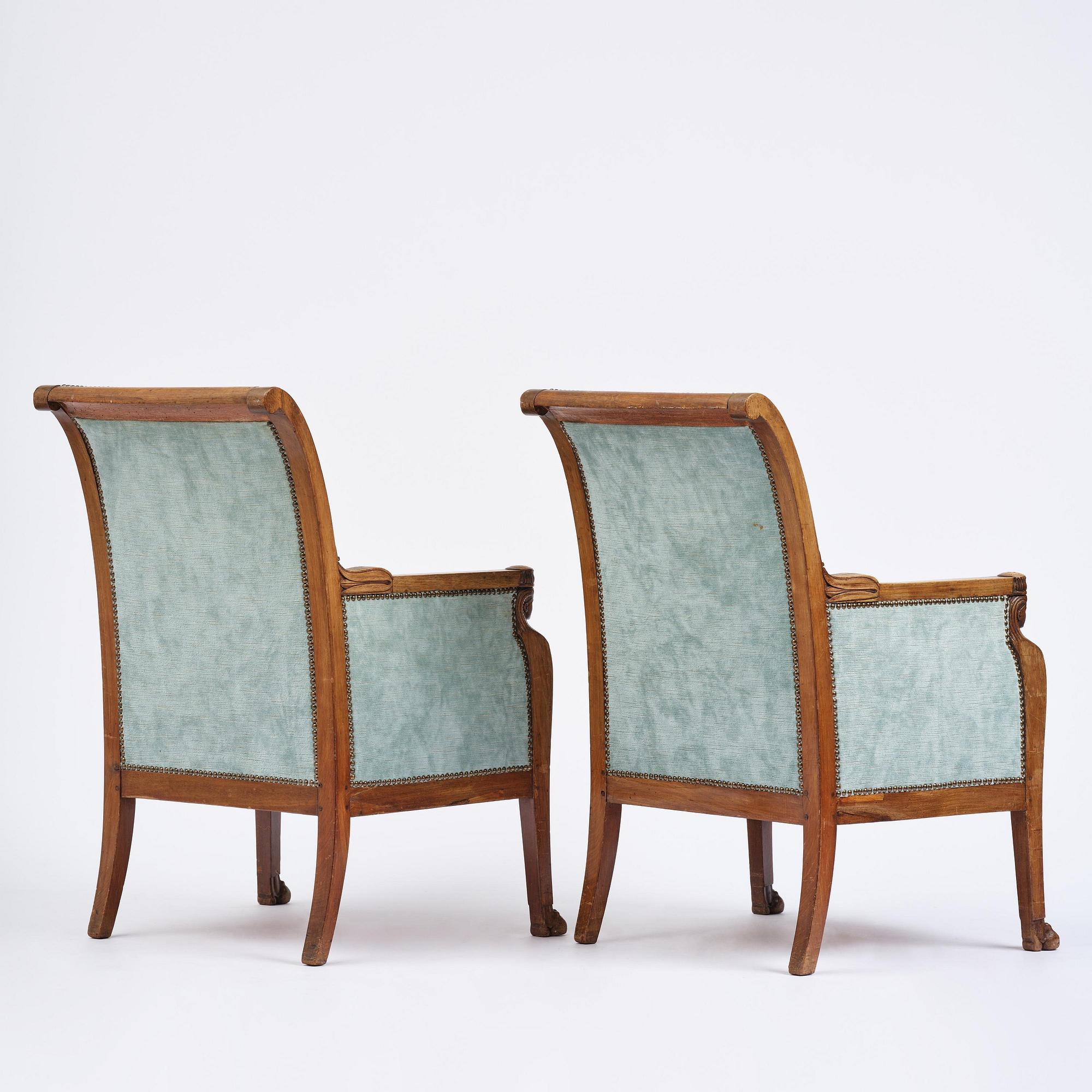 A pair of French Empire mahogny armchairs.