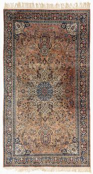 An oriental rug, circa 245 x 136 cm.