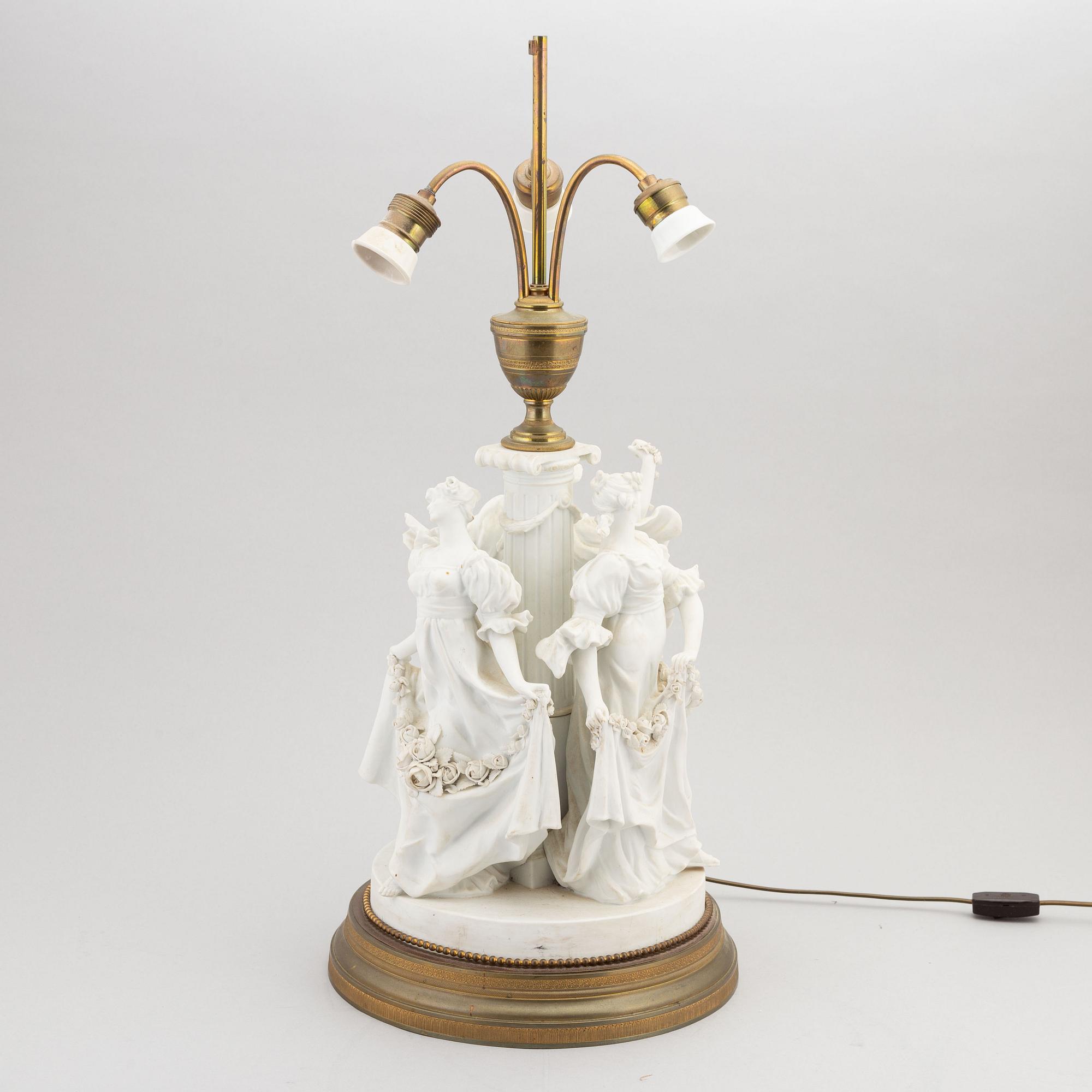 A parian and metall table lamp, first half of the 20th century.