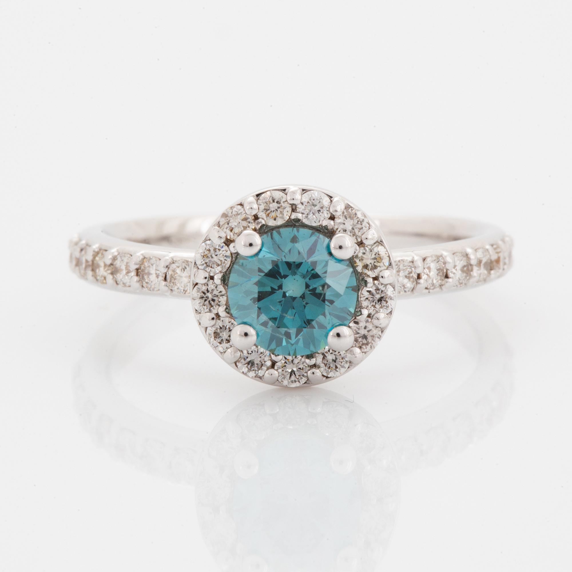 Ring, med briljantslipad blå färgbehandlad diamant.