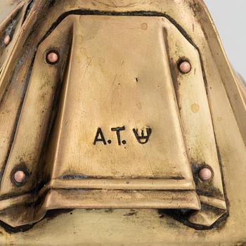 A metal storm lantern, marked A.T, circa 1900.