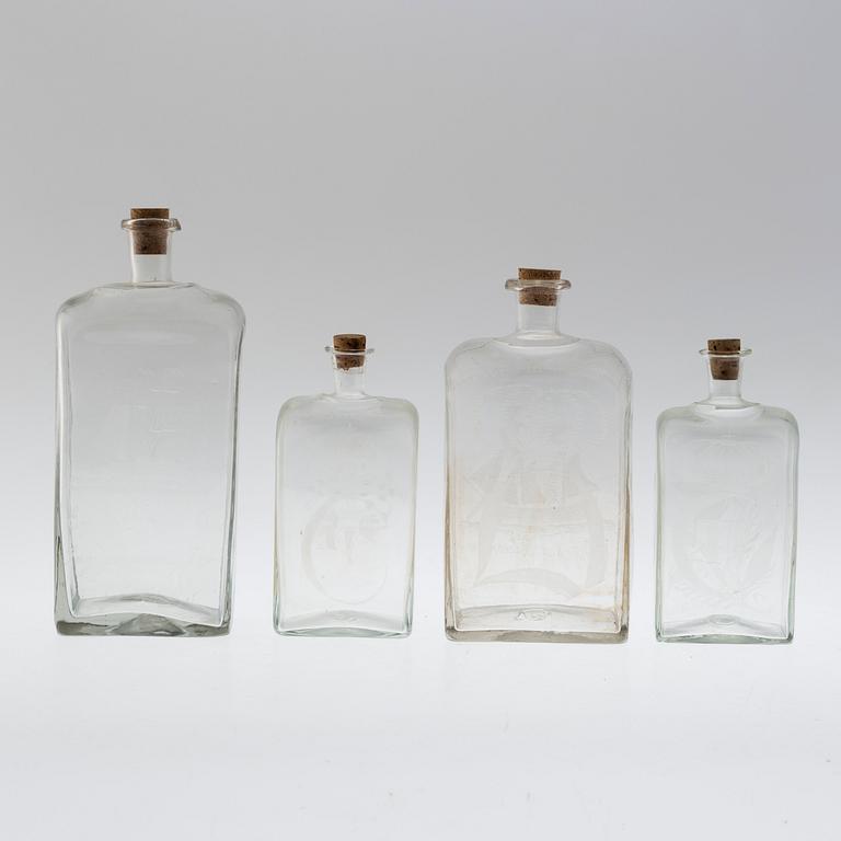 Four brandy bottles, 19/20th century.