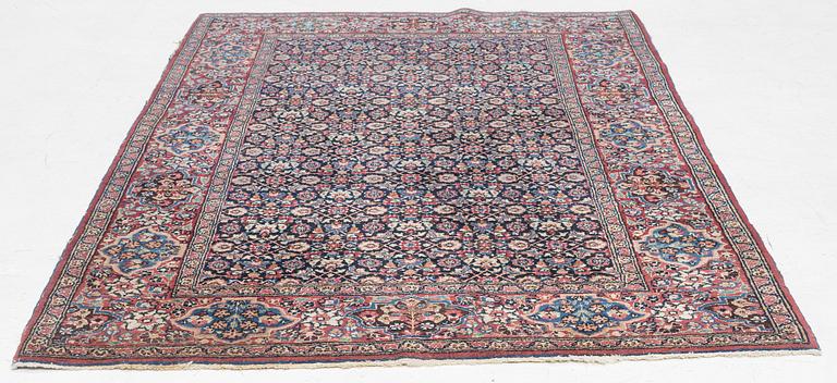 A rug, probably Meshed, semi-antique, c. 180 x 125 cm.
