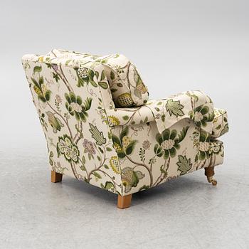 A 'Howard' armchair with footstool, Englesson.