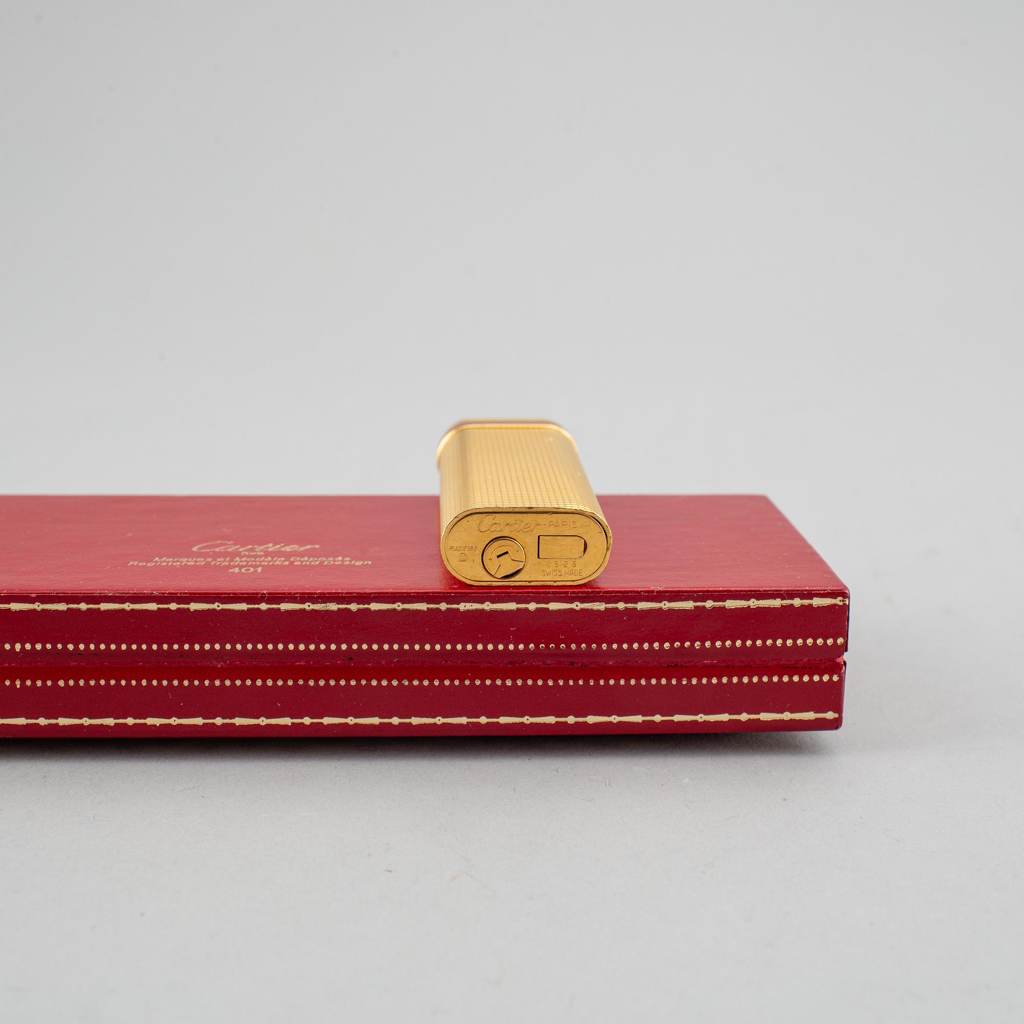 A Cartier lighter and pen.