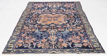 An antique Hamadan, c. 315 x 155 cm.