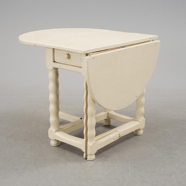 An 18th century gate leg table.