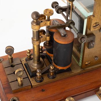 A telegraph from LM Ericsson, and a telegraph key from Digney Frères, early 20th century.