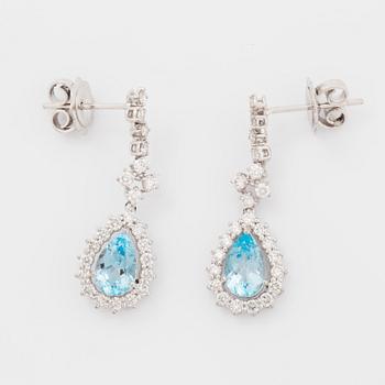 Topaz and brilliant-cut diamond earrings.