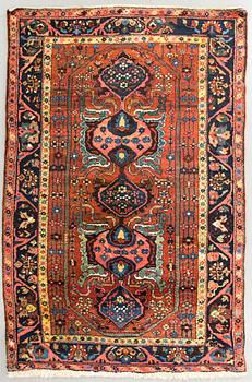 An antique Hamadan carpet ca 199 x 129 cm.