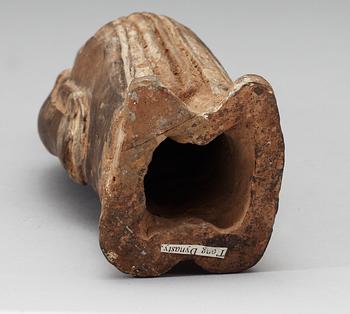 A painted pottery figure of a standing female, Tang dynasty (618-907).