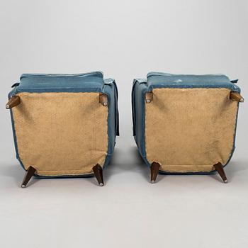 A pair of mid-20th century armchairs.