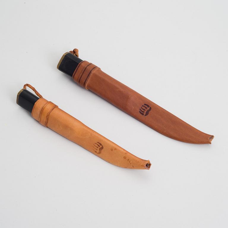 TAPIO WIRKKALA, TWO SHEATH KNIVES. Marked Hackman Finland Stainless Tapio Wirkkala. Designed in 1961.