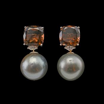 389. A PAIR OF EARRINGS, black south sea pearl 15 mm. Smoke quartz and navette-cut diamonds c. 0.30 ct.