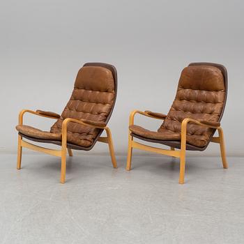 A pair of 1970's 'Mona' armchairs by Sam Larsson for Dux.