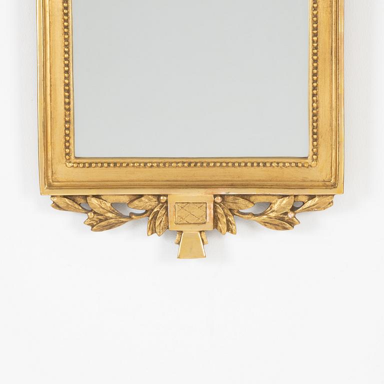 A Gustavian style mirror, mid 20th Century.