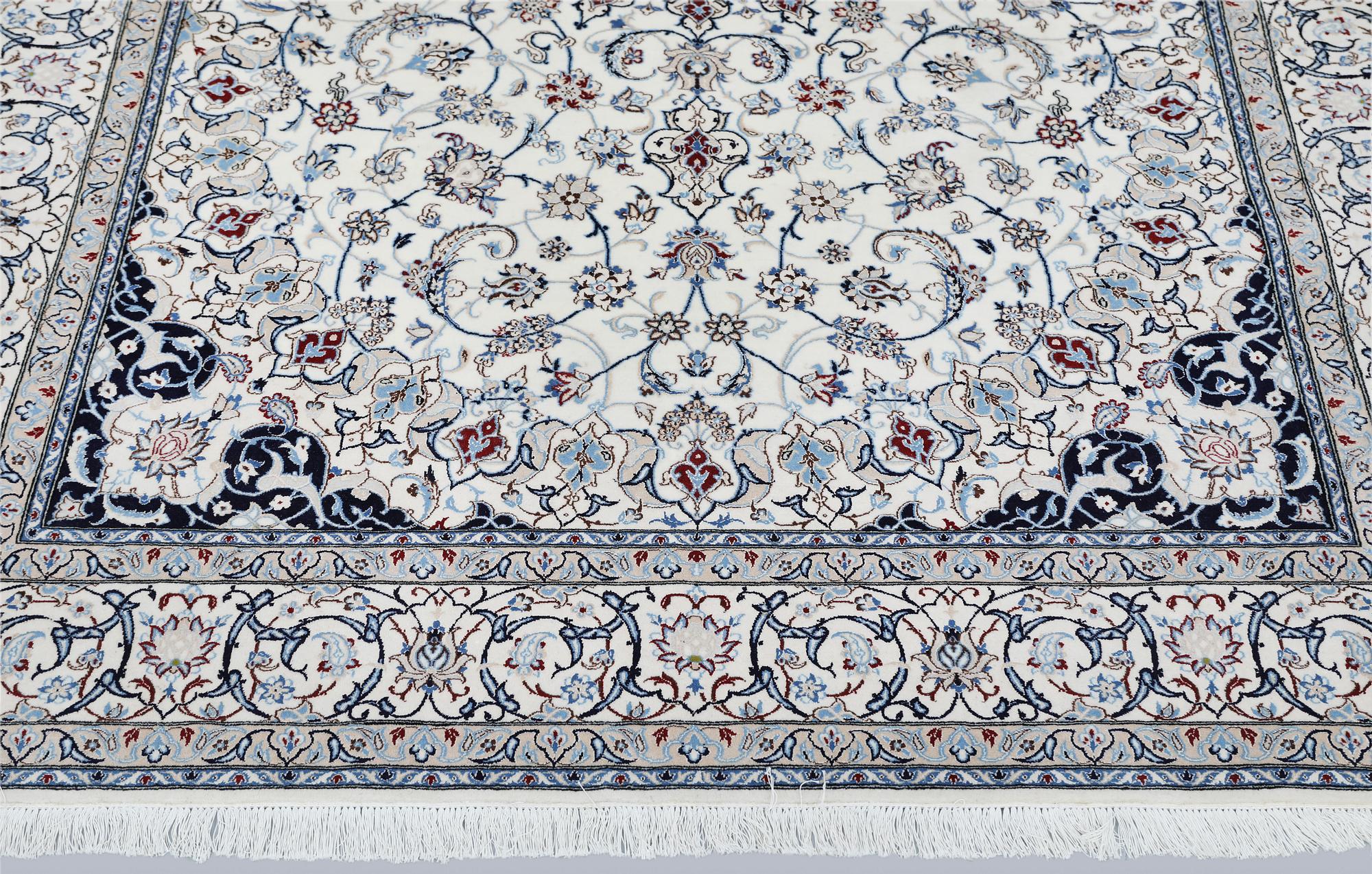 A Nain carpet, part silk, so called 6LAA, approximately 279 x 200 cm.