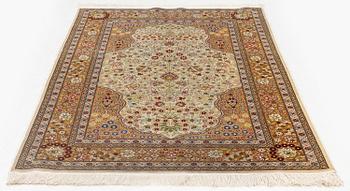 A double-nisch silk Hereke rug, c. 125 x 78 cm.