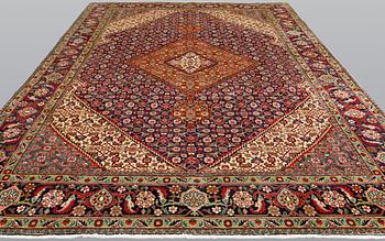 A Tabriz carpet, approximately 360 x 255 cm.