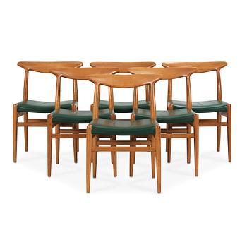 36. Hans J. Wegner, a set of six oak chairs, CM Madsen Fabriker, Denmark.