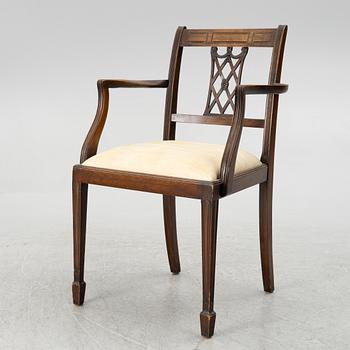 A mahogany and mahogany veneer desk with desk chair, 20th Century.