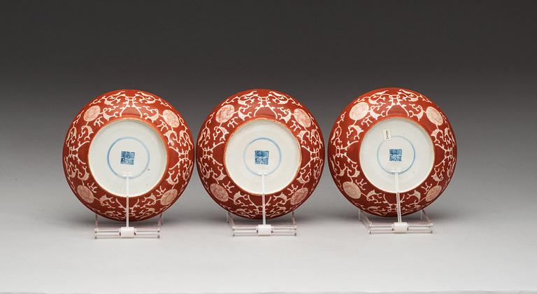A set of three coral red dishes, Qing dynasty, with Daoguang seal mark.