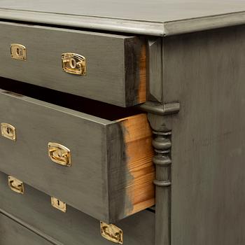 A painted chest of drawers, circa 1900.