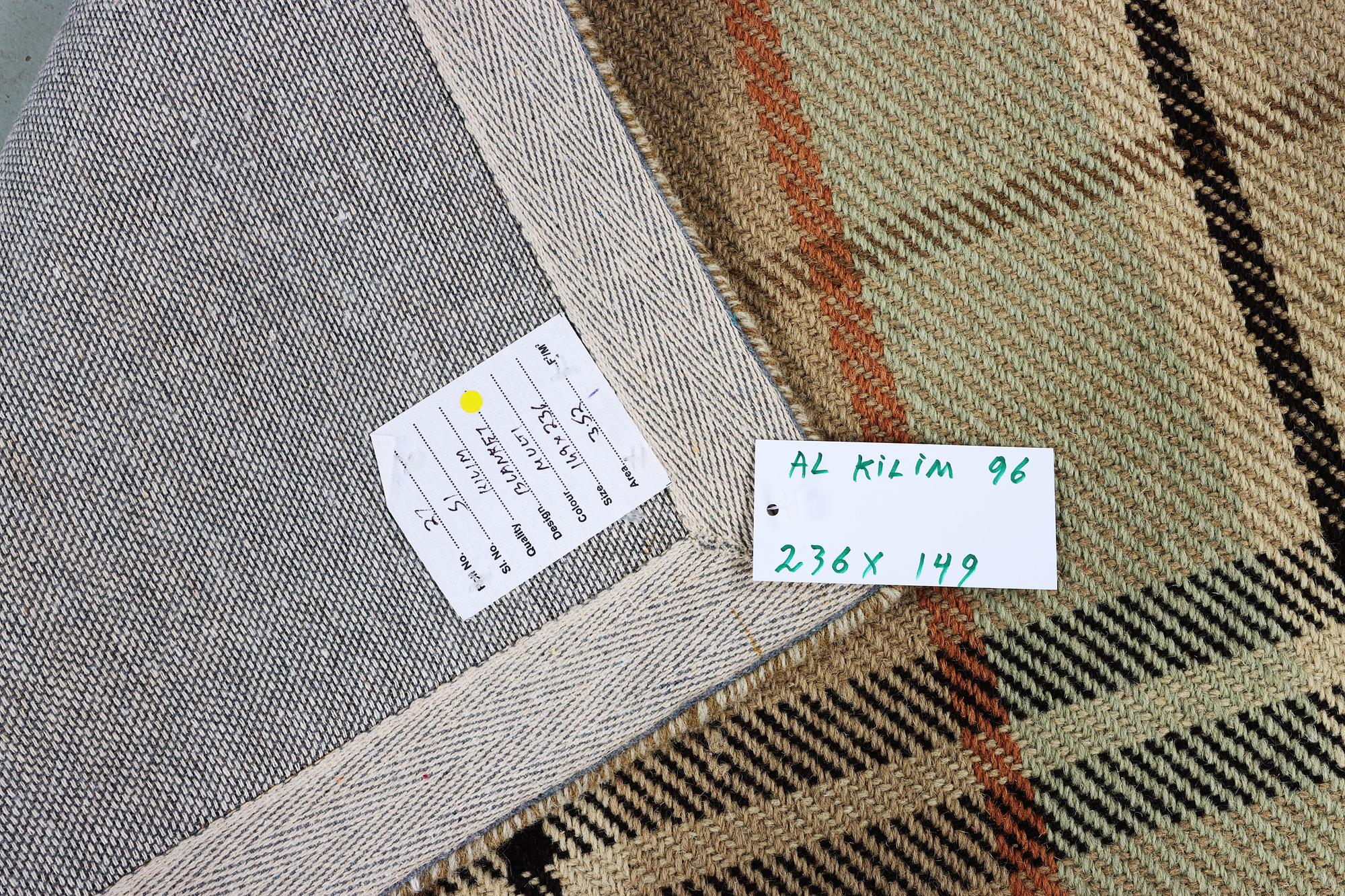 A "blanket" design rug, c. 236 x 149 cm.