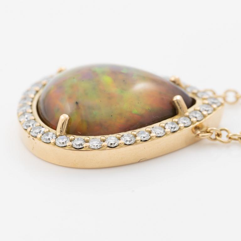 Necklace in 18K gold with a drop-shaped opal and octagon-cut diamonds.