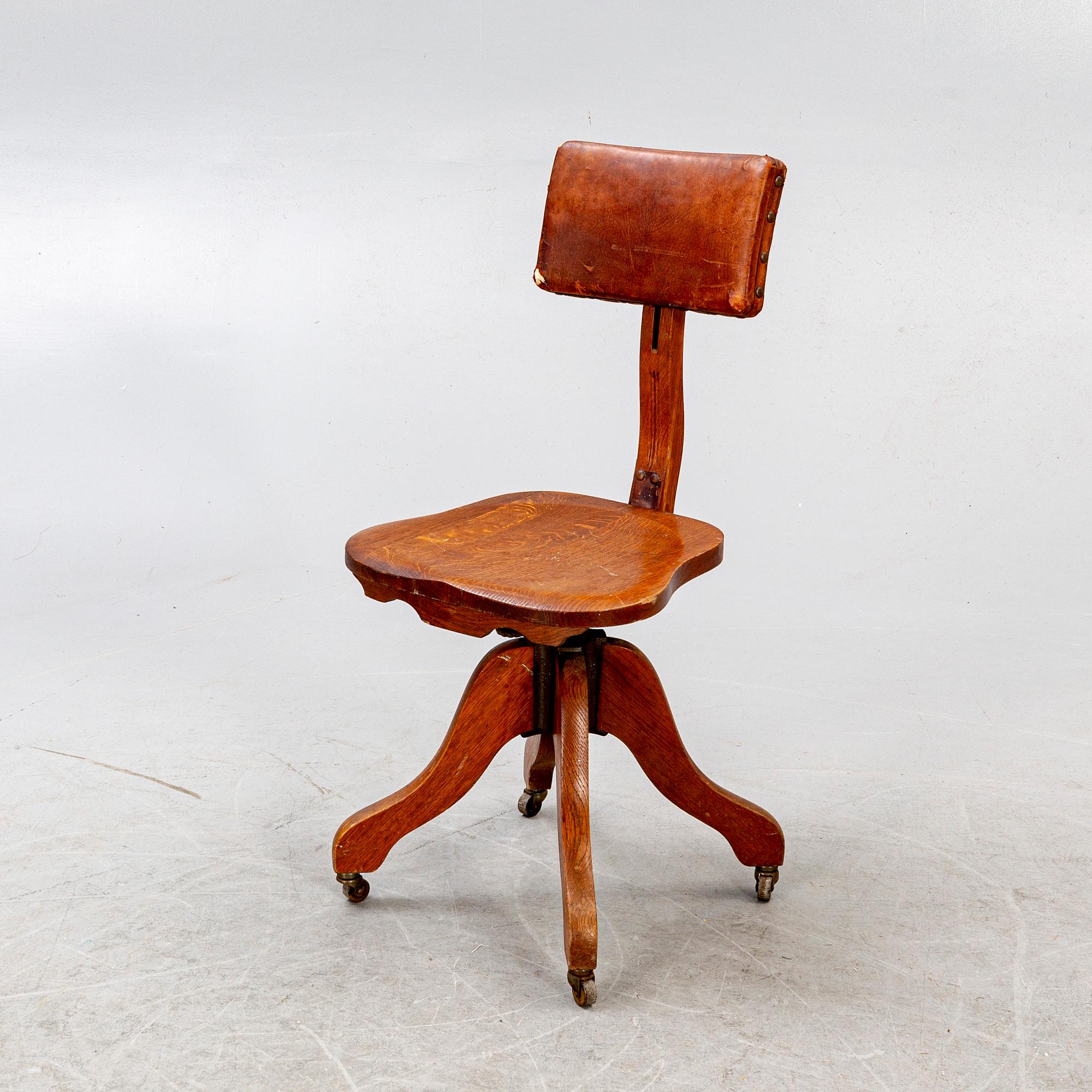 An early 1900s oak office chair.