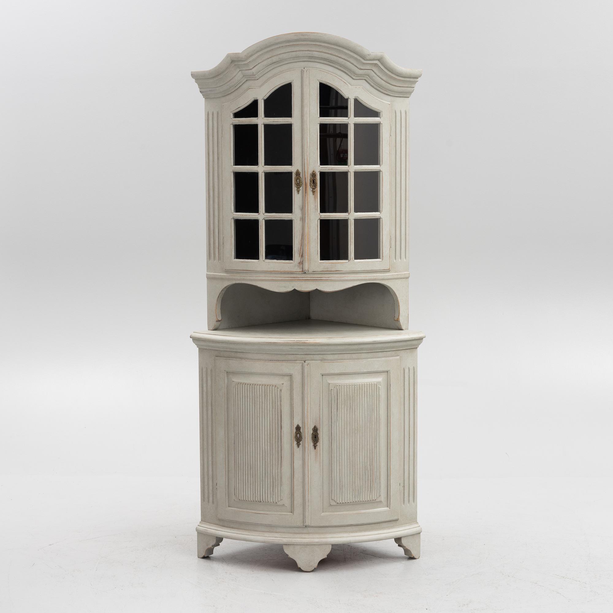 A Gustavian style 20th century corner cabinet.