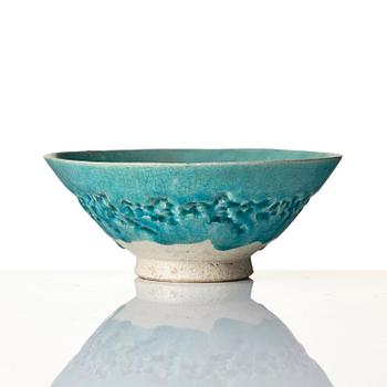 A Kashan Turquoise glazed conical pottery bowl, central Persia, 13th century.