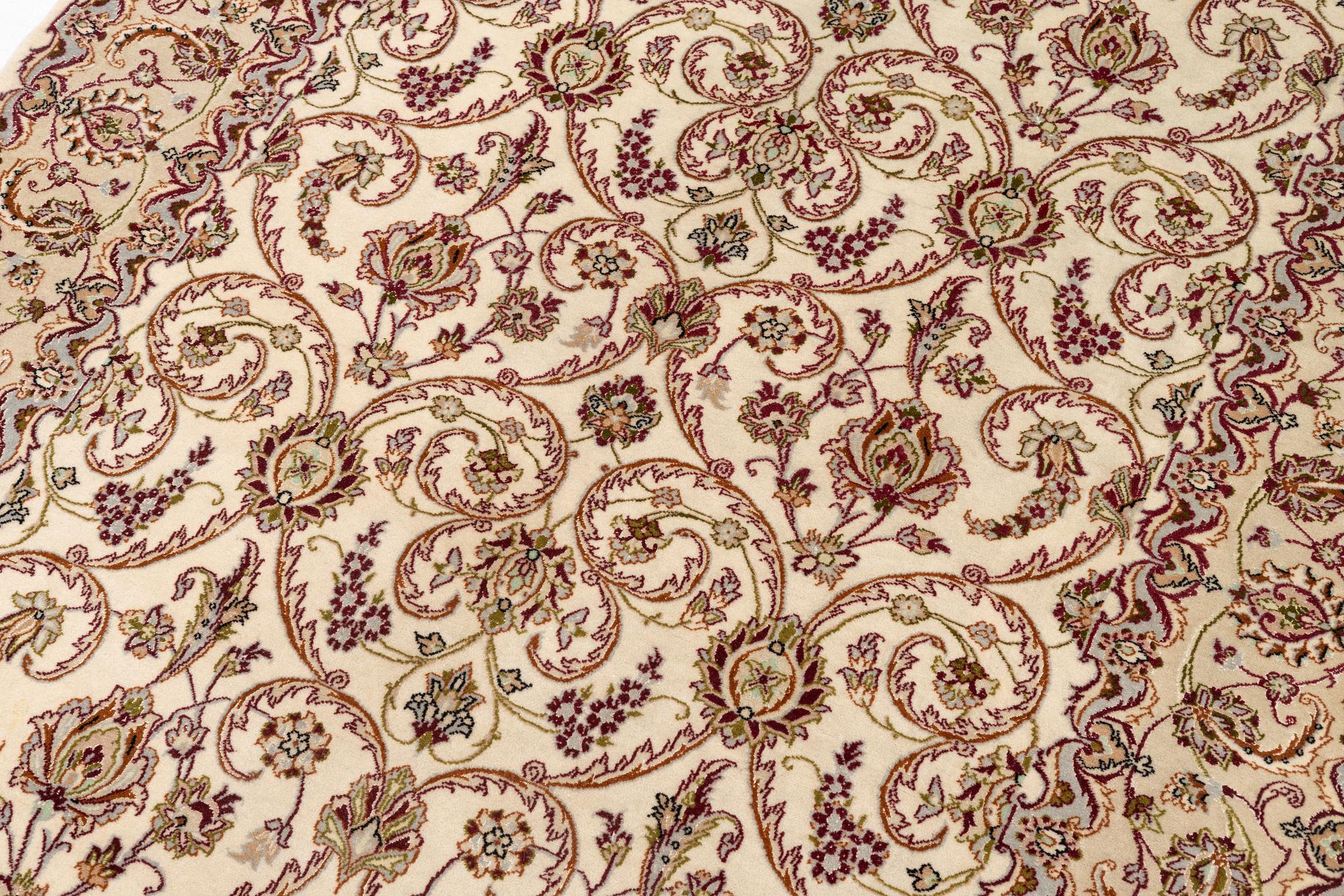 An Isfahan, part silk rug, signed, c. 165 x 112 cm.