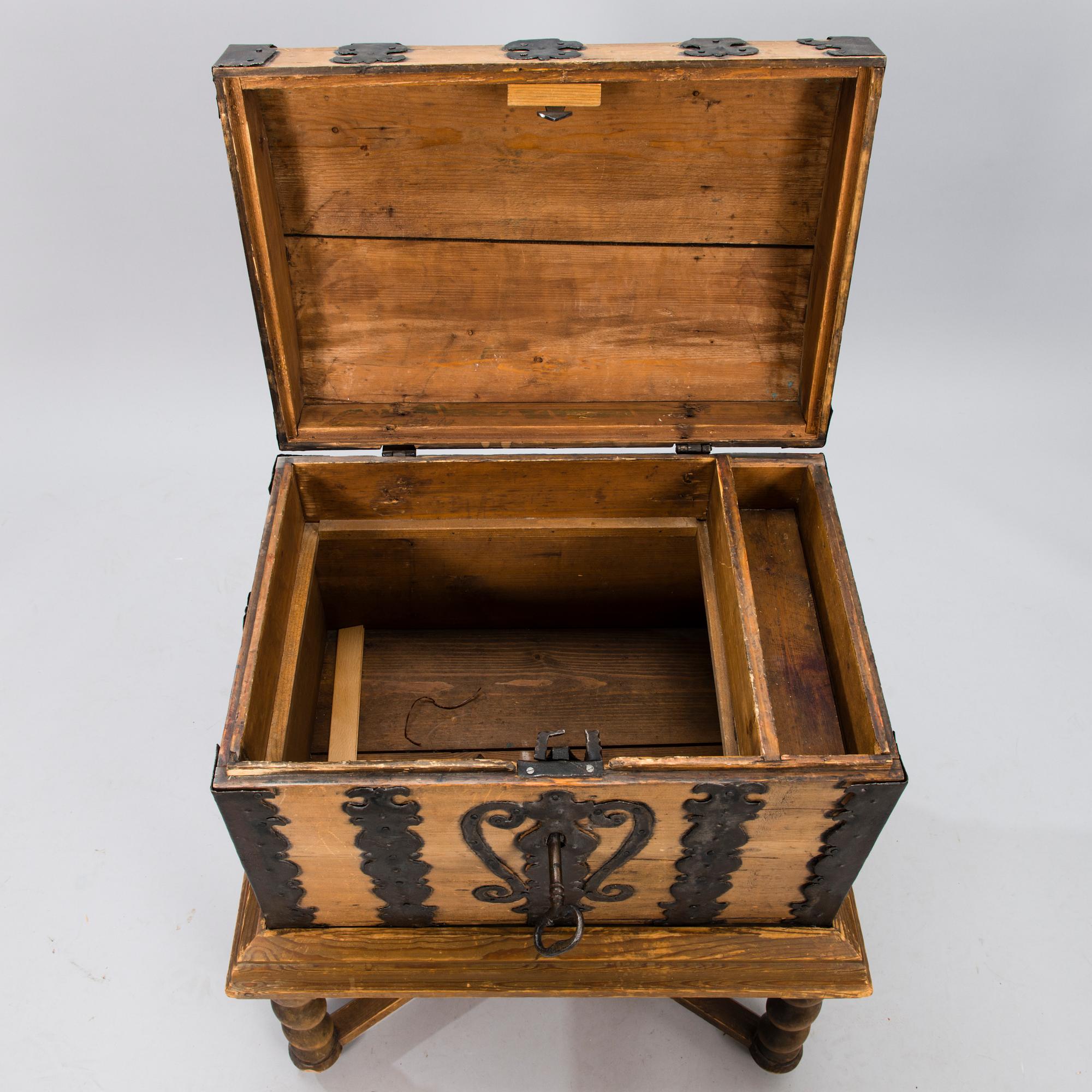 A oak baroque chest on a later leg frame.