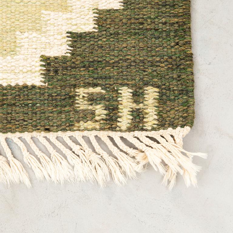 Flat-weave rug signed SH, approximately 194x133 cm.