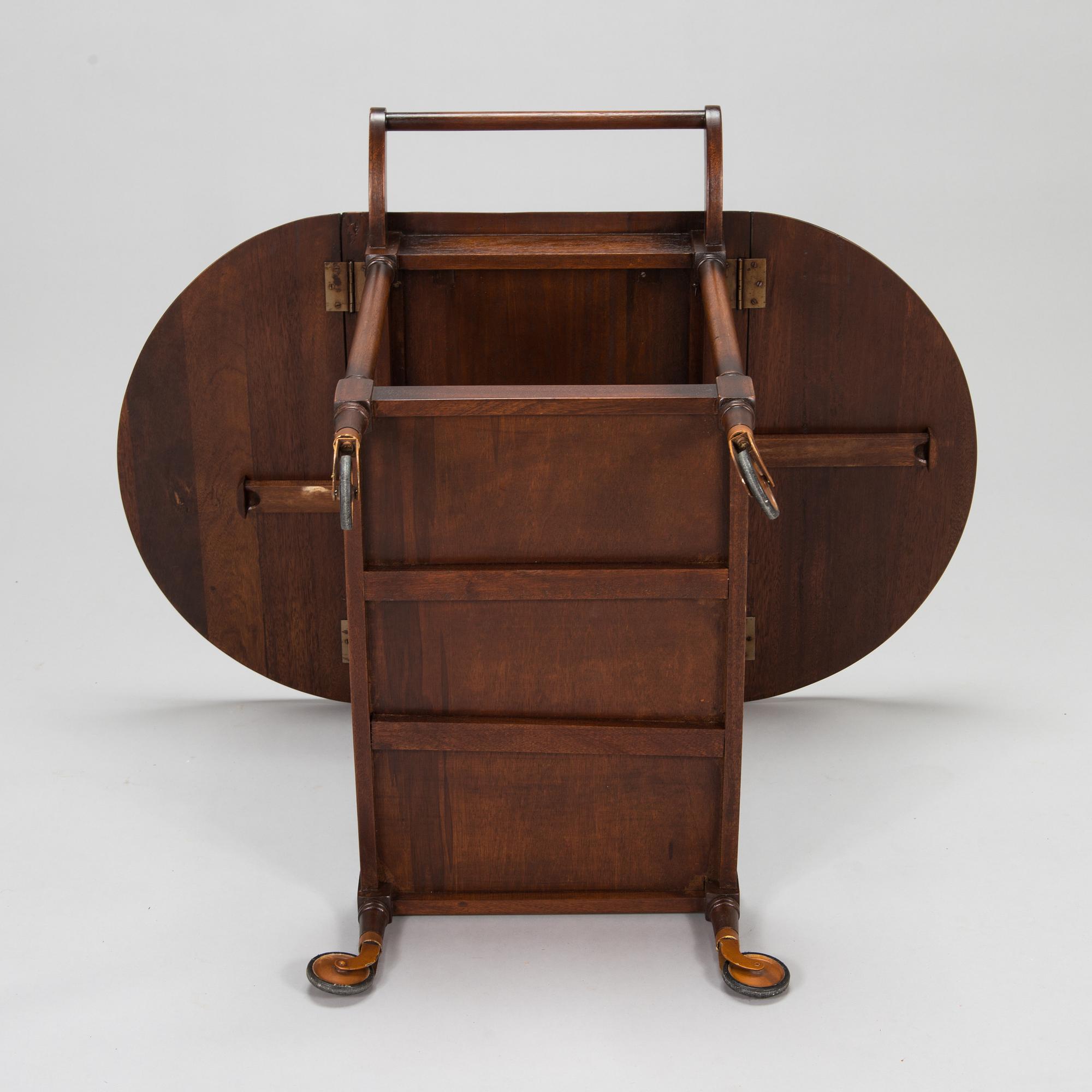 A drop-leaf tea trolley from the latter half of the 20th century.