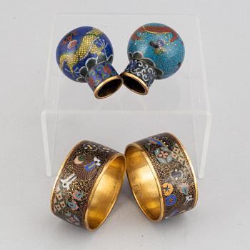 Two cloisonné cane tops and two napkin rings, China, first half of 20th Century.