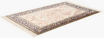 A silk Qum rug, c. 156 x 101 cm.