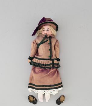 An early 20th cnetury porcelin doll, probably Germany.