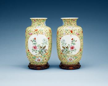 A pair of famille rose vases, presumably Republic, first half of 20th Century with Hongxians mark.