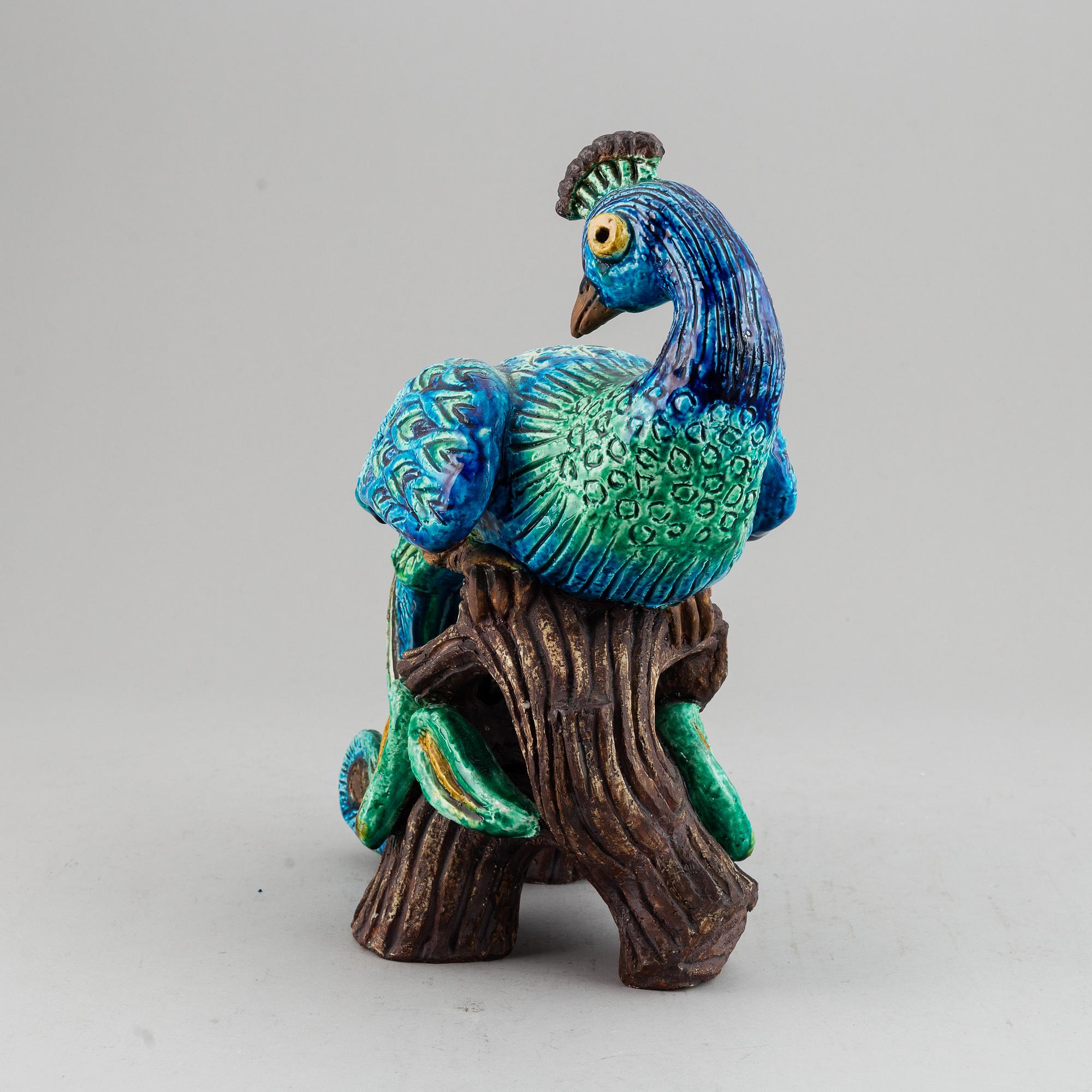 GUNNAR NYLUND, a stoneware figurine of a peacock, Rörstrand.