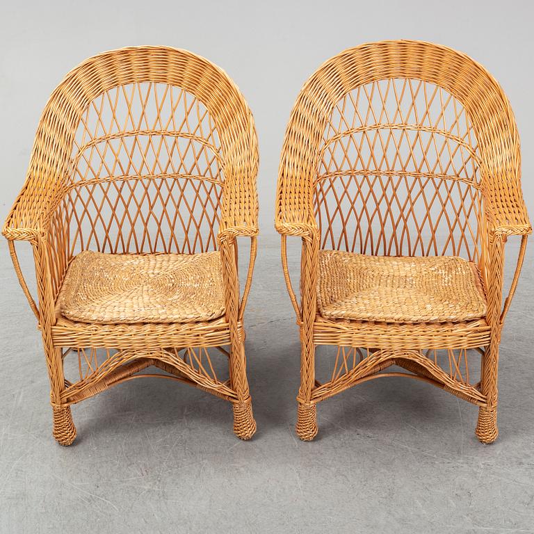 A pair of 1970s/1980s rattan armchairs.