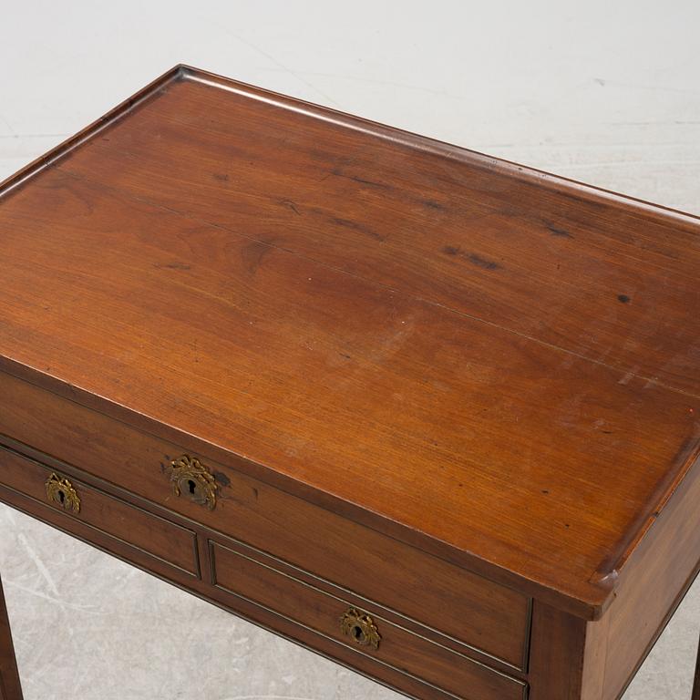 A late Gustavian mahogany writing table from araound the year 1800.