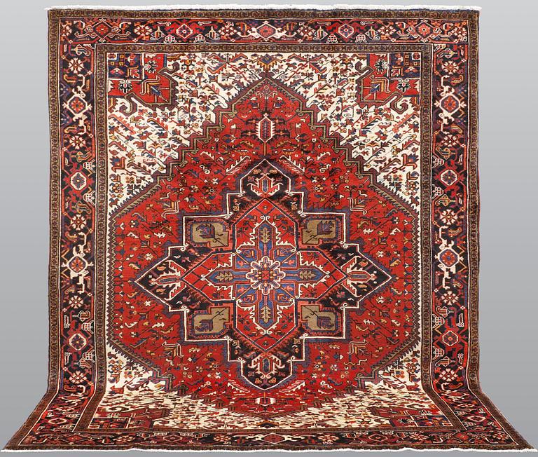 A carpet, Heriz, c. 307 x 246 cm.