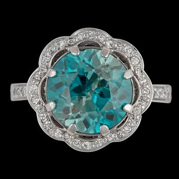A blue zircon and brilliant cut diamond ring.