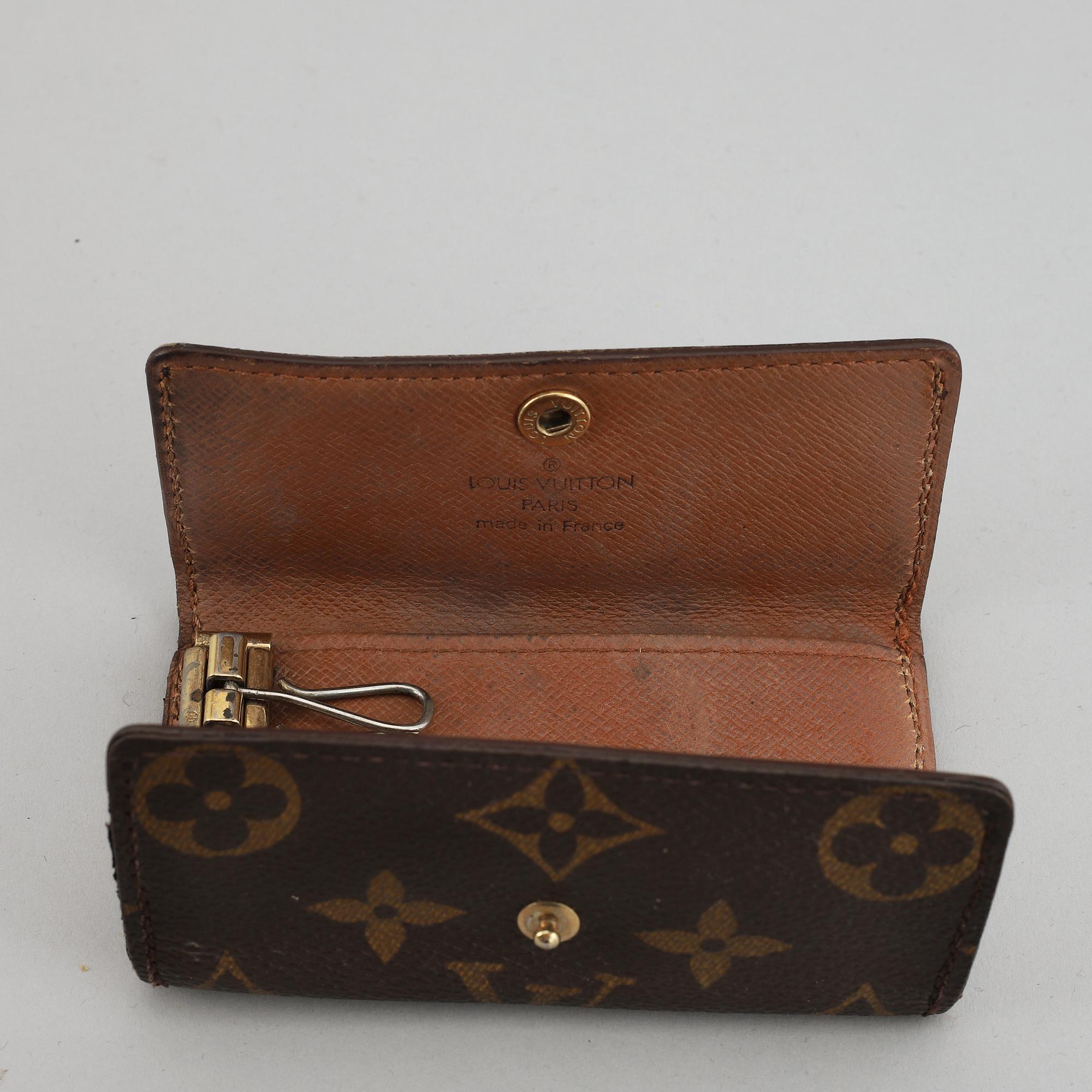 LOUIS VUITTON, a 'Trousse toilette 28' toilet bag and a key case.