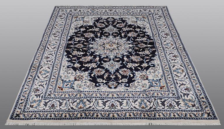 A carpet, Nain, part silk, ca 212 x 153 cm.